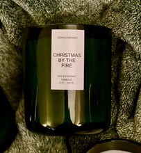 Load image into Gallery viewer, 12 green jar candle, apple harvest scent on fuzzy green blanket