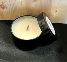 Load image into Gallery viewer, 5 oz black round candle tin with lid, with wood wick on grey fabric and wood background