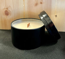 Load image into Gallery viewer, 5 oz black round candle tin with lid, with wood wick on grey fabric and wood background
